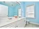 Clean and bright bathroom featuring double sinks and a window for natural light at 5650 Barefoot Resort Bridge Rd. # 431, North Myrtle Beach, SC 29582
