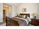 Tranquil bedroom with a large, comfortable bed, wood-look floors and a calming color scheme at 5650 Barefoot Resort Bridge Rd. # 431, North Myrtle Beach, SC 29582