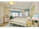 Inviting bedroom with neutral tones, a sitting area, and access to the balcony at 5650 Barefoot Resort Bridge Rd. # 431, North Myrtle Beach, SC 29582