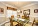 Bright dining room includes decorative chandelier, mirror, and bright window at 5650 Barefoot Resort Bridge Rd. # 431, North Myrtle Beach, SC 29582