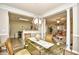 Open dining room includes a decorative chandelier and access to living areas at 5650 Barefoot Resort Bridge Rd. # 431, North Myrtle Beach, SC 29582