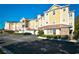 Multi-Gathering building with yellow siding, brown trim and parking in front at 5650 Barefoot Resort Bridge Rd. # 431, North Myrtle Beach, SC 29582