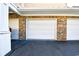 The attached garages feature brick exteriors with a light and neutral trim at 5650 Barefoot Resort Bridge Rd. # 431, North Myrtle Beach, SC 29582