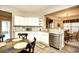 Open kitchen features white cabinetry, granite countertops, and stainless steel dishwasher at 5650 Barefoot Resort Bridge Rd. # 431, North Myrtle Beach, SC 29582