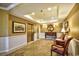 Building foyer with elevator, light sconces, artwork, tile floor and seating at 5650 Barefoot Resort Bridge Rd. # 431, North Myrtle Beach, SC 29582
