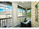 Cozy screened porch with seating, offering beautiful views of the community at 5650 Barefoot Resort Bridge Rd. # 431, North Myrtle Beach, SC 29582