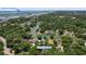 Aerial view of the property, showcasing waterfront access and surrounding lush greenery at 571 Fernwood Rd., Murrells Inlet, SC 29576