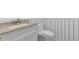 Bathroom showcasing a vanity with a granite countertop and a white toilet at 571 Fernwood Rd., Murrells Inlet, SC 29576
