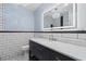 Newly renovated bathroom with modern lighting, fixtures, and subway tile at 571 Fernwood Rd., Murrells Inlet, SC 29576