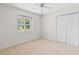 Bright and clean carpeted bedroom with ceiling fan and double closet at 571 Fernwood Rd., Murrells Inlet, SC 29576