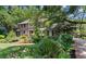 Charming two-story brick home boasts mature landscaping, a well-manicured lawn, and a welcoming entrance at 571 Fernwood Rd., Murrells Inlet, SC 29576