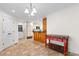 Bright kitchen featuring tile floors, ample cabinetry, and a red accent table at 571 Fernwood Rd., Murrells Inlet, SC 29576