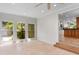 Bright sunroom filled with many large windows showing the outside yard at 571 Fernwood Rd., Murrells Inlet, SC 29576