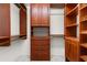 Walk-in closet with built-in wooden shelves and drawers to maximize storage at 571 Fernwood Rd., Murrells Inlet, SC 29576