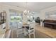 Open dining area with sliding doors to patio and backyard at 5716 Lombardia Circle, Myrtle Beach, SC 29579