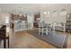 Open-concept dining area with island seating and stainless steel appliances at 5716 Lombardia Circle, Myrtle Beach, SC 29579
