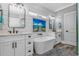 Luxurious bathroom with a soaking tub, double vanities, and elegant fixtures, creating a spa-like retreat at 6001 - 1195 S Kings Hwy., Myrtle Beach, SC 29575