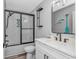 Modern bathroom with a black-framed shower, sleek vanity, and stylish fixtures at 6001 - 1195 S Kings Hwy., Myrtle Beach, SC 29575