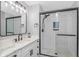 Modern bathroom with sleek black fixtures, subway tile, a glass shower, and stylish vanity with elegant marble countertop at 6001 - 1195 S Kings Hwy., Myrtle Beach, SC 29575