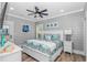 Inviting bedroom with coastal decor, a plush bed, and a ceiling fan for added comfort at 6001 - 1195 S Kings Hwy., Myrtle Beach, SC 29575