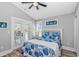 Bright bedroom featuring a queen bed, balcony access, and tasteful coastal decor at 6001 - 1195 S Kings Hwy., Myrtle Beach, SC 29575