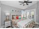Bright bedroom with coastal decor, a queen bed, and access to a balcony with outdoor seating at 6001 - 1195 S Kings Hwy., Myrtle Beach, SC 29575