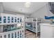 Charming bedroom featuring two white bunk beds with a beach-themed decor and lovely, coastal accents at 6001 - 1195 S Kings Hwy., Myrtle Beach, SC 29575