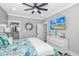 Serene bedroom featuring coastal-themed decor, a ceiling fan, and ample natural light at 6001 - 1195 S Kings Hwy., Myrtle Beach, SC 29575