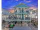 Stunning two-story home with balconies, outdoor seating, and parking for golf carts underneath at 6001 - 1195 S Kings Hwy., Myrtle Beach, SC 29575