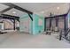 A spacious, well-lit garage with a turquoise accent wall that offers ample space for parking and storage with a sitting area at 6001 - 1195 S Kings Hwy., Myrtle Beach, SC 29575