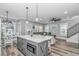 Open-concept kitchen with island seating, stainless appliances, and a view to the living room at 6001 - 1195 S Kings Hwy., Myrtle Beach, SC 29575