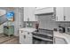 A kitchen with white cabinets, stainless steel appliances and subway tile backsplash at 6001 - 1195 S Kings Hwy., Myrtle Beach, SC 29575