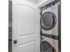 Convenient laundry closet featuring a stacked washer and dryer unit, maximizing space and efficiency at 6001 - 1195 S Kings Hwy., Myrtle Beach, SC 29575