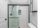 Modern tiled shower with glass doors and matte black fixtures at 6001 - 1195 S Kings Hwy., Myrtle Beach, SC 29575