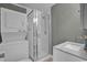 Modern bathroom with a glass door shower, sleek vanity, and in unit laundry machines at 6001 - 1459 S Kings Hwy., Myrtle Beach, SC 29575