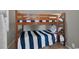 bedroom with a wood bunk bed and a blue and white striped comforter at 6001 - 1459 S Kings Hwy., Myrtle Beach, SC 29575