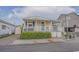 Charming beach home with a covered porch, white railings, and convenient storage, ideal for coastal living at 6001 - 1459 S Kings Hwy., Myrtle Beach, SC 29575