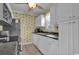 Functional kitchen with stainless steel appliances, white cabinets, and ample countertop space at 6001 - 1459 S Kings Hwy., Myrtle Beach, SC 29575