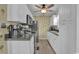 Well-lit kitchen with stainless steel appliances, granite countertops and white cabinetry at 6001 - 1459 S Kings Hwy., Myrtle Beach, SC 29575