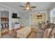 Living room featuring hardwood floors, couch, television, and access to a dining area at 6001 - 1459 S Kings Hwy., Myrtle Beach, SC 29575