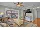 Spacious living room with a couch, hardwood flooring, and view into sunroom and hallway at 6001 - 1459 S Kings Hwy., Myrtle Beach, SC 29575