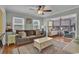 Inviting living room with a comfortable sofa, hardwood floors, and connecting sunroom at 6001 - 1459 S Kings Hwy., Myrtle Beach, SC 29575