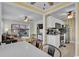 Open concept living space connecting dining, kitchen and sunroom with hardwood flooring at 6001 - 1459 S Kings Hwy., Myrtle Beach, SC 29575