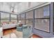 Bright sunroom filled with natural light, comfortable seating, and charming decor, perfect for relaxation at 6001 - 1459 S Kings Hwy., Myrtle Beach, SC 29575