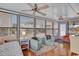 Bright sunroom featuring hardwood floors, ceiling fans, and comfortable seating at 6001 - 1459 S Kings Hwy., Myrtle Beach, SC 29575