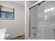 Bathroom featuring glass shower, modern fixtures, and natural light from a window at 6001 - Z-49 S Kings Hwy., Myrtle Beach, SC 29575
