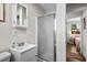 A modern bathroom with a sink, vanity, shower, and stylish gray-toned flooring at 6001 - Z-49 S Kings Hwy., Myrtle Beach, SC 29575