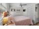 Bright bedroom featuring a comfortable bed, neutral decor, and a mounted flatscreen TV at 6001 - Z-49 S Kings Hwy., Myrtle Beach, SC 29575