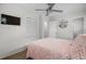 Bedroom with a ceiling fan, a flatscreen TV, and neutral decor, perfect for relaxation at 6001 - Z-49 S Kings Hwy., Myrtle Beach, SC 29575