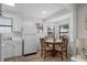 Sunny dining area with natural light and coastal decor and opens to kitchen at 6001 - Z-49 S Kings Hwy., Myrtle Beach, SC 29575